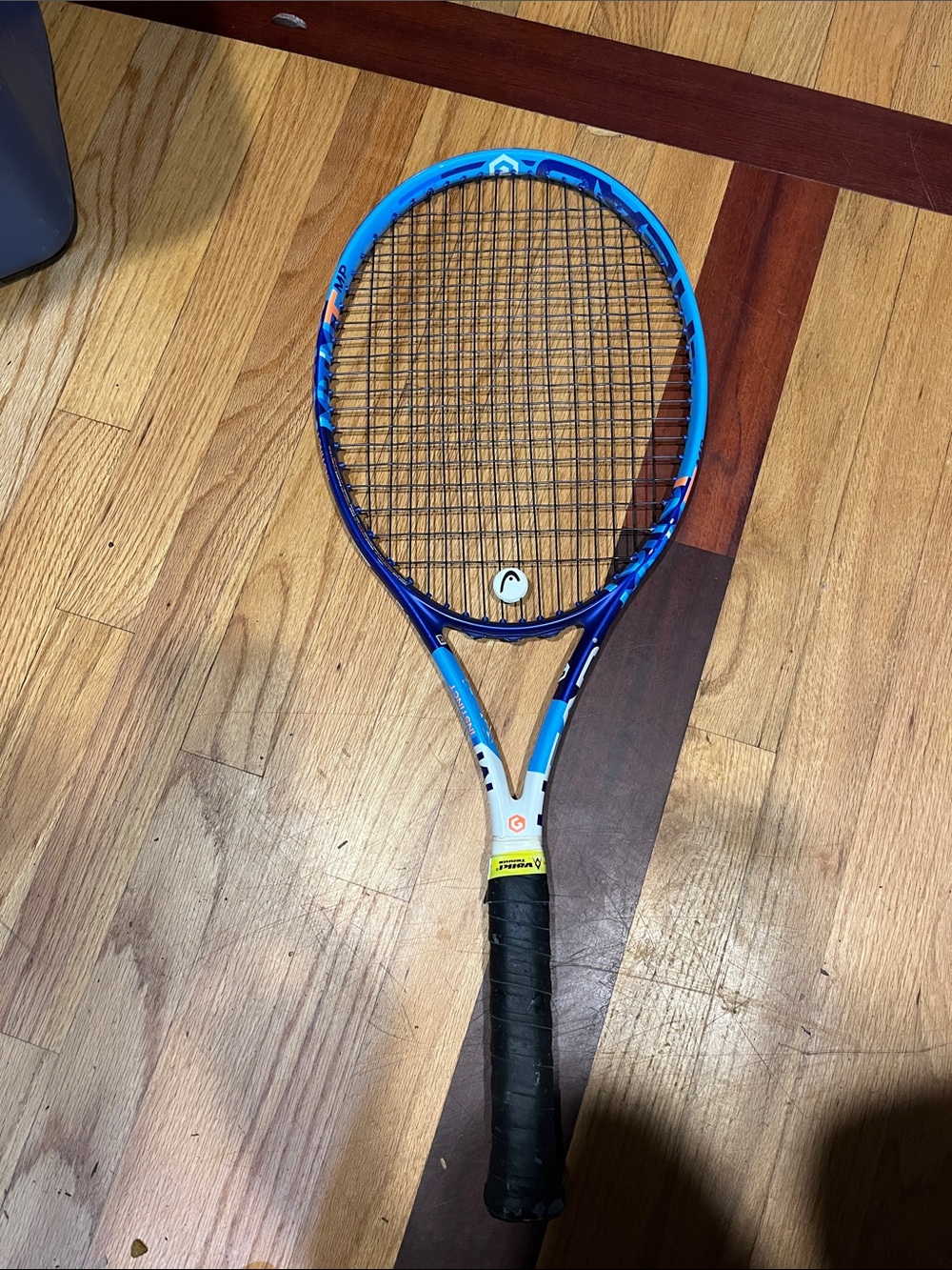 Blue Tennis Racket with Black Grip